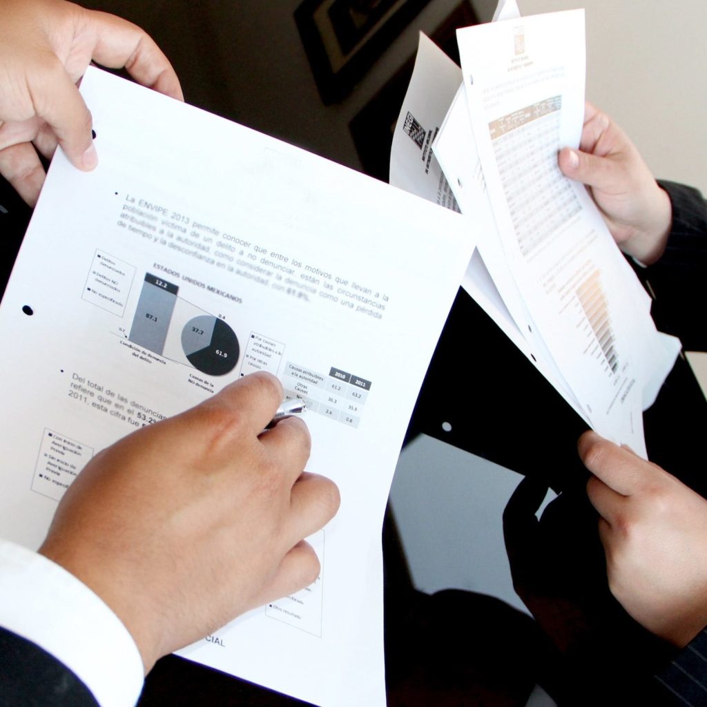 Person Holding Document Papers